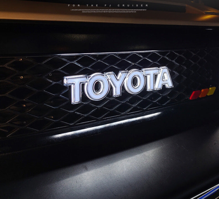 FJ Cruiser LED Luminous Grille Logo – Illuminated Front Emblem Toyota Letter Badge (Fits 2007–2023)